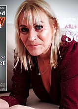59 year old British GILF Secret loves to play with her shaved pussy at home on the sofa